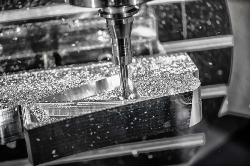 Metalworking CNC milling machine. Cutting metal modern processing technology. Small depth of field. Warning - authentic shooting in challenging conditions. A little bit grain and maybe blurred.